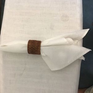 White linen napkins & wicker napkin rings